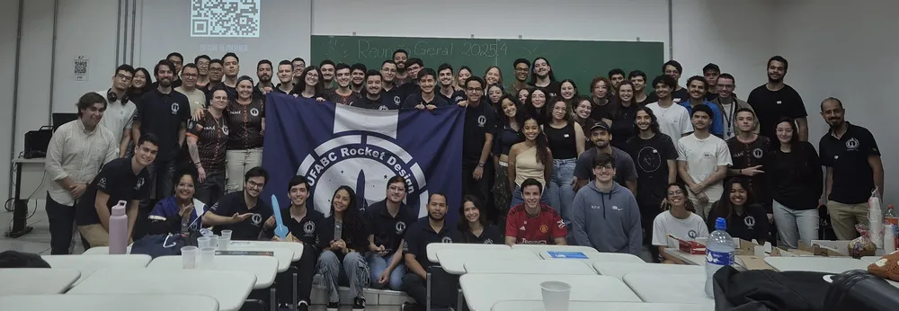 Foto da equipe em uam reunião geral